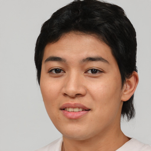 Joyful asian young-adult female with medium  black hair and brown eyes