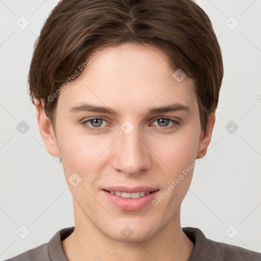 Joyful white young-adult female with short  brown hair and grey eyes