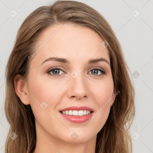 Joyful white young-adult female with long  brown hair and green eyes