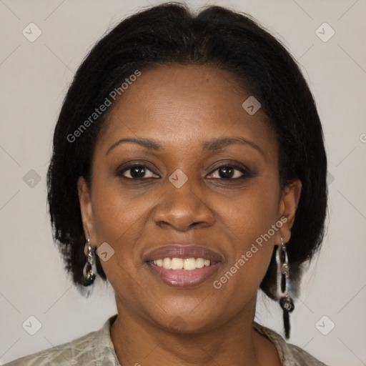 Joyful latino adult female with medium  brown hair and brown eyes