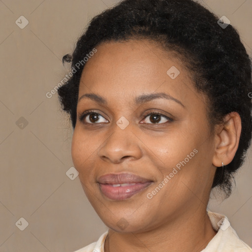 Joyful black adult female with short  brown hair and brown eyes