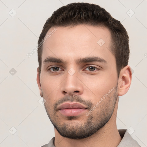 Neutral white young-adult male with short  brown hair and brown eyes