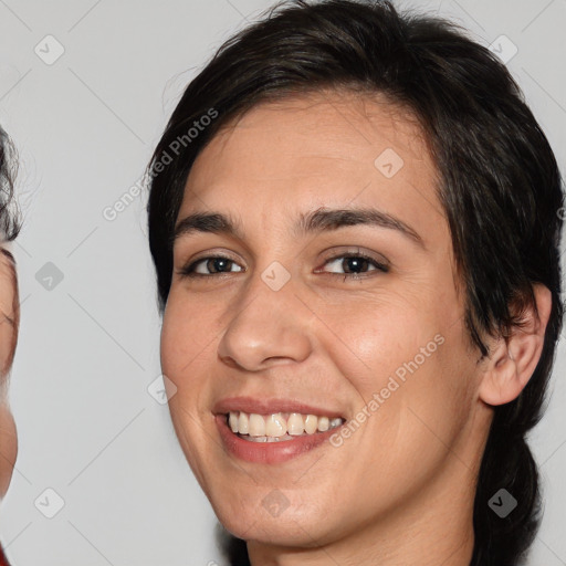 Joyful white young-adult female with medium  brown hair and brown eyes