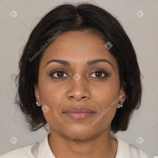 Joyful black adult female with medium  brown hair and brown eyes