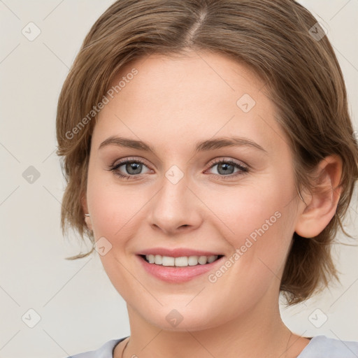 Joyful white young-adult female with medium  brown hair and green eyes