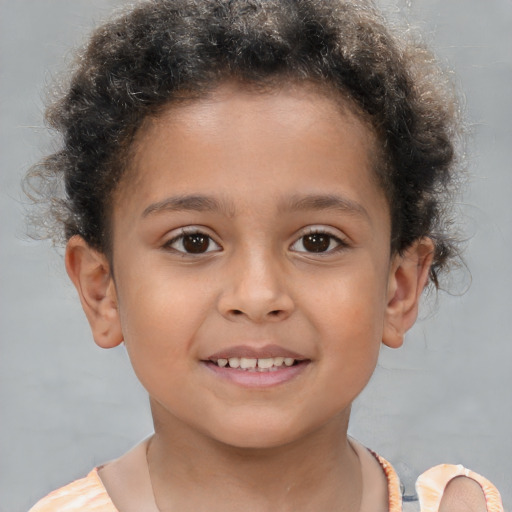 Joyful white child male with short  brown hair and brown eyes