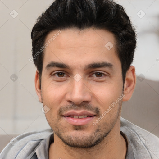 Joyful white young-adult male with short  black hair and brown eyes