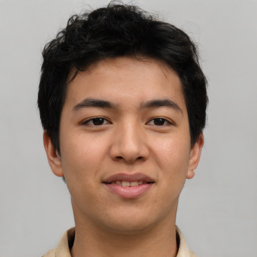 Joyful asian young-adult male with short  brown hair and brown eyes