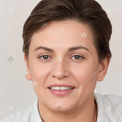 Joyful white young-adult female with short  brown hair and grey eyes