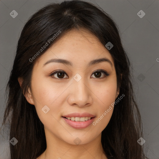 Joyful asian young-adult female with long  brown hair and brown eyes