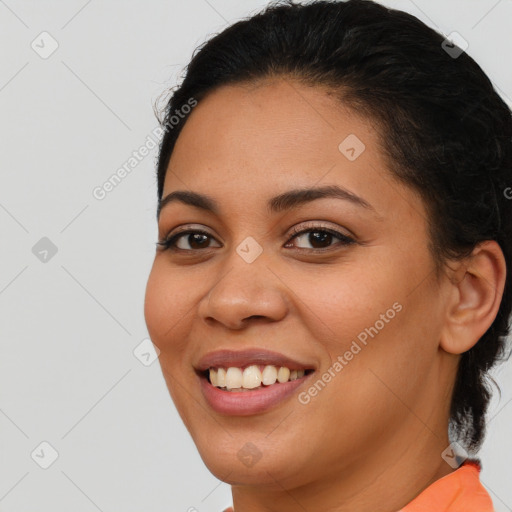 Joyful latino young-adult female with long  brown hair and brown eyes