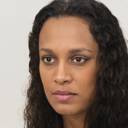 Neutral black young-adult female with long  brown hair and brown eyes