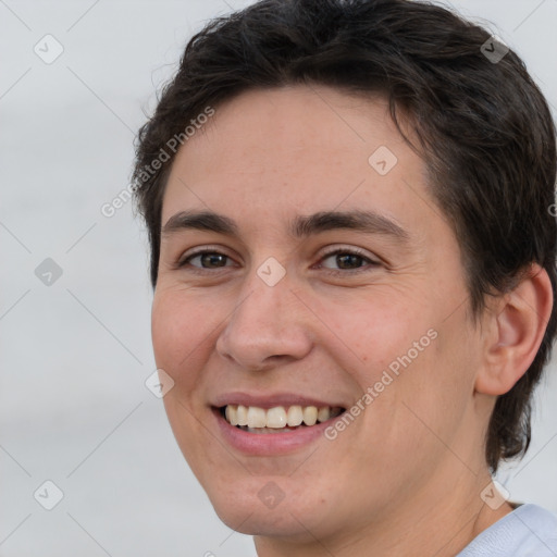 Joyful white young-adult female with short  brown hair and brown eyes