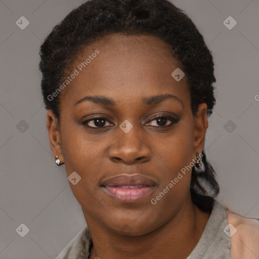 Joyful black young-adult female with short  black hair and brown eyes