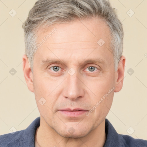 Neutral white adult male with short  brown hair and grey eyes