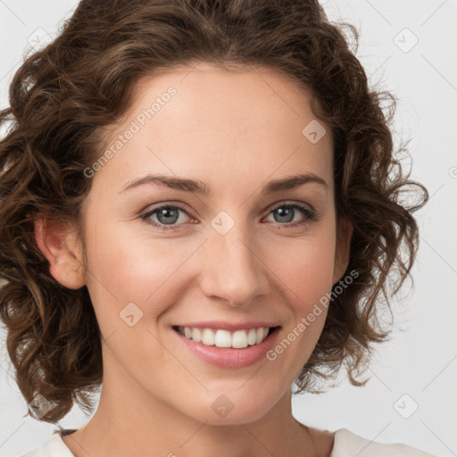 Joyful white young-adult female with medium  brown hair and green eyes