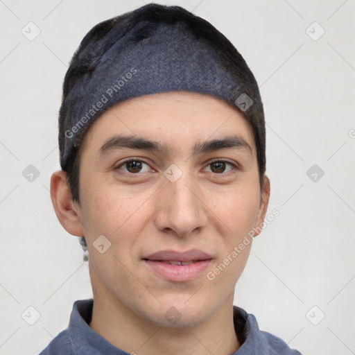 Joyful white young-adult male with short  black hair and brown eyes