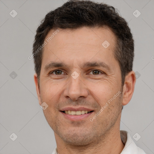 Joyful white adult male with short  brown hair and brown eyes