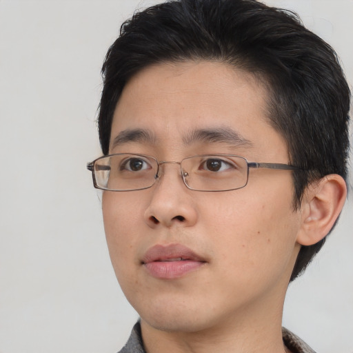 Neutral asian young-adult male with short  brown hair and brown eyes
