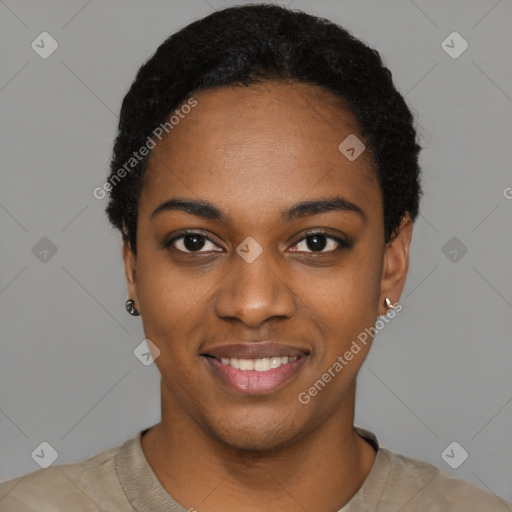 Joyful black young-adult female with short  black hair and brown eyes