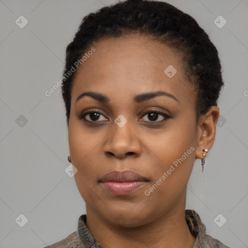 Joyful black young-adult female with short  black hair and brown eyes