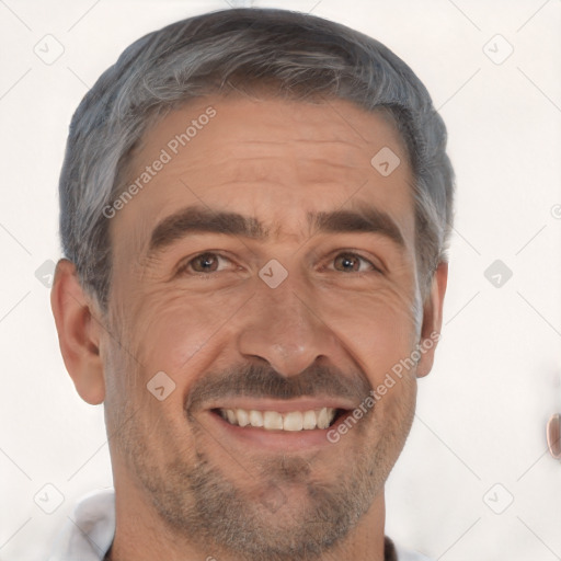 Joyful white adult male with short  black hair and brown eyes