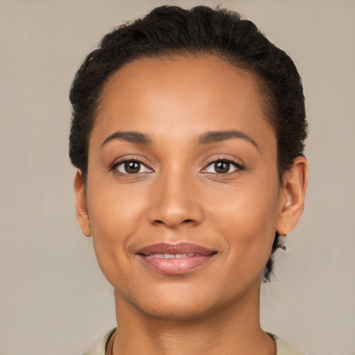 Joyful latino young-adult female with short  brown hair and brown eyes