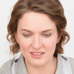 Joyful white young-adult female with medium  brown hair and blue eyes