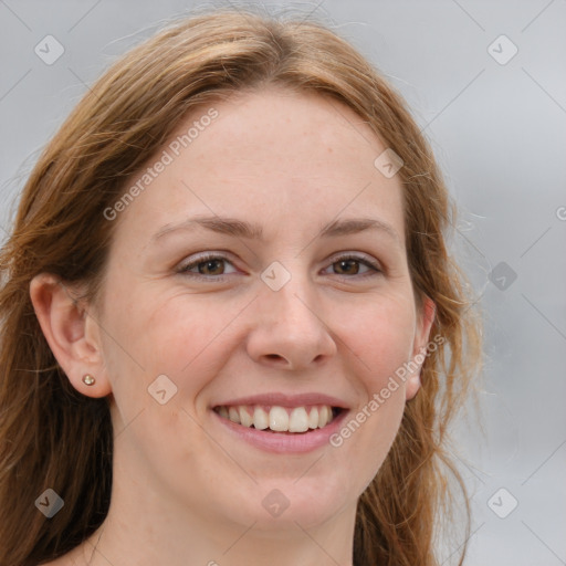 Joyful white young-adult female with medium  brown hair and blue eyes