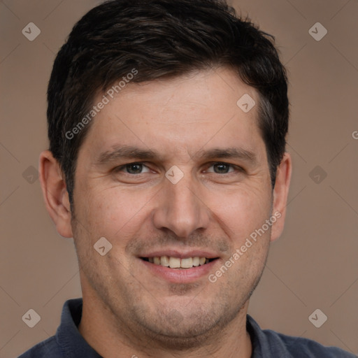 Joyful white adult male with short  brown hair and brown eyes