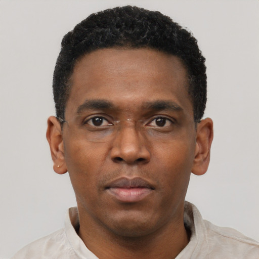 Neutral black young-adult male with short  black hair and brown eyes