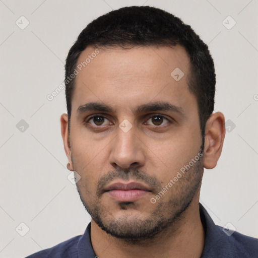 Neutral latino young-adult male with short  black hair and brown eyes