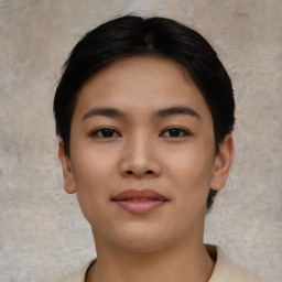 Joyful asian young-adult female with short  black hair and brown eyes