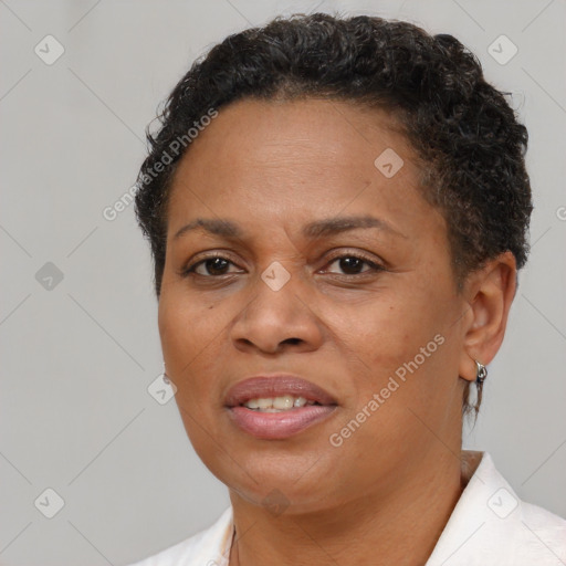 Joyful black adult female with short  brown hair and brown eyes