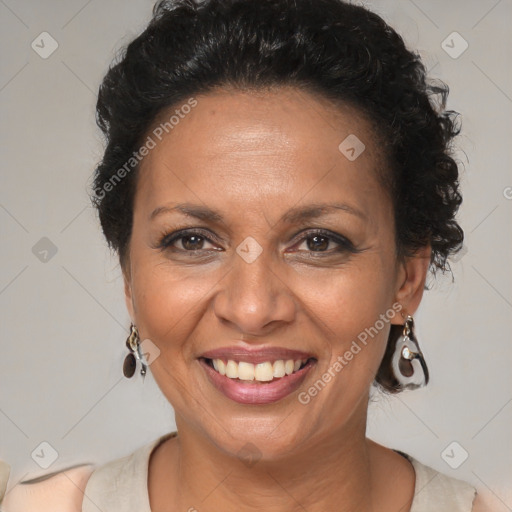 Joyful black adult female with medium  brown hair and brown eyes