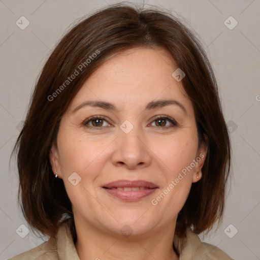 Joyful white adult female with medium  brown hair and brown eyes