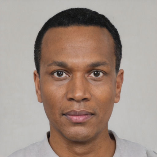 Neutral black adult male with short  black hair and brown eyes
