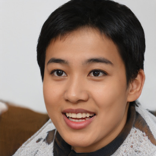 Joyful asian young-adult female with short  brown hair and brown eyes