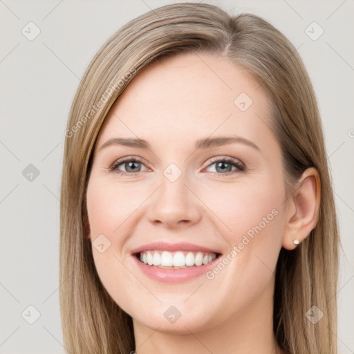 Joyful white young-adult female with long  brown hair and grey eyes