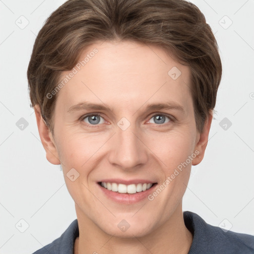 Joyful white young-adult female with short  brown hair and grey eyes