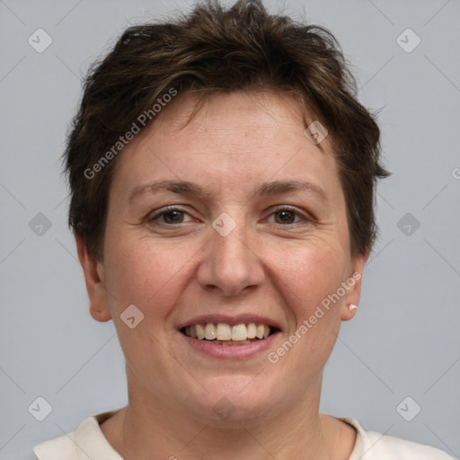 Joyful white adult female with short  brown hair and brown eyes