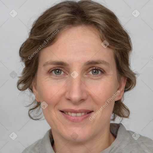 Joyful white adult female with medium  brown hair and grey eyes