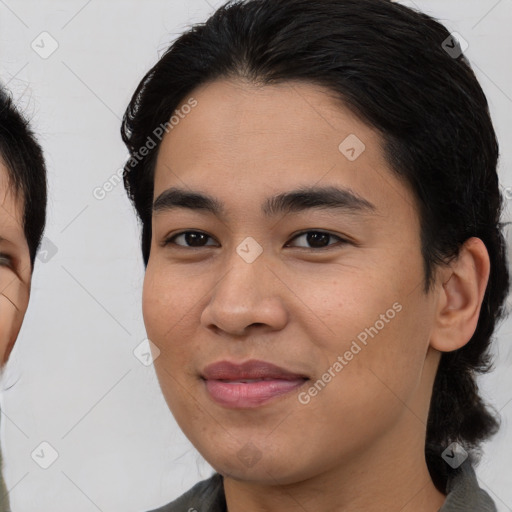 Joyful asian young-adult female with medium  black hair and brown eyes