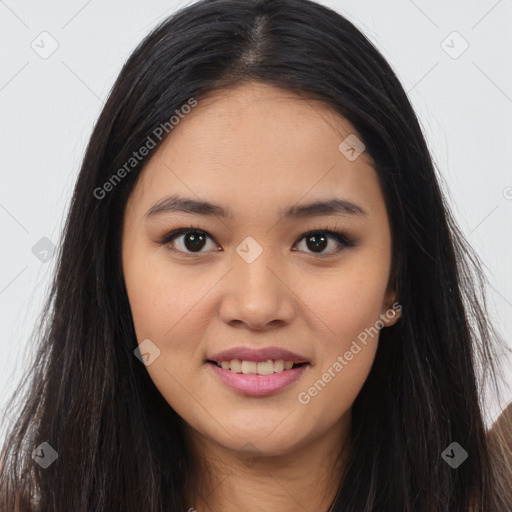 Joyful asian young-adult female with long  brown hair and brown eyes