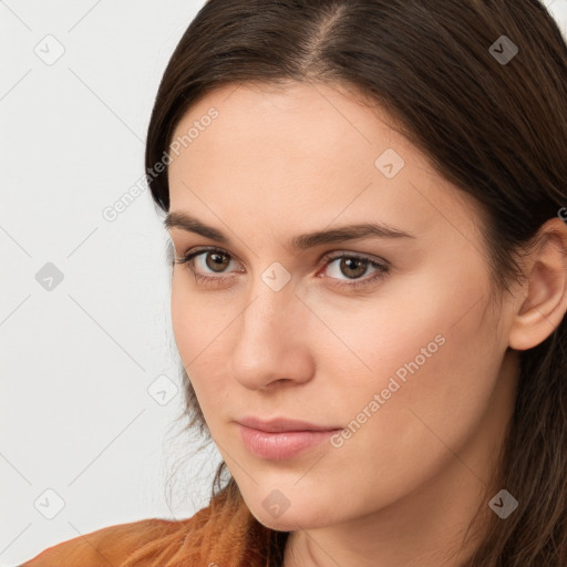 Neutral white young-adult female with long  brown hair and brown eyes