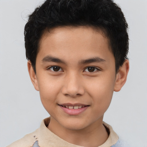 Joyful white child male with short  brown hair and brown eyes