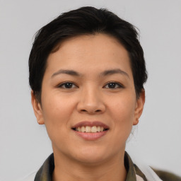 Joyful asian young-adult female with short  brown hair and brown eyes