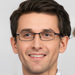 Joyful white adult male with short  brown hair and grey eyes