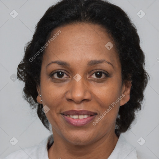 Joyful black adult female with short  brown hair and brown eyes