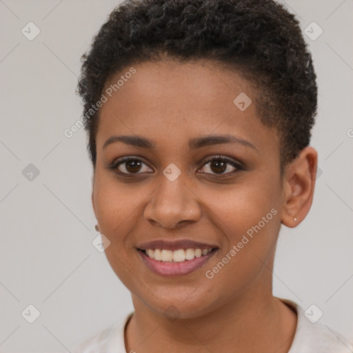 Joyful black young-adult female with short  brown hair and brown eyes